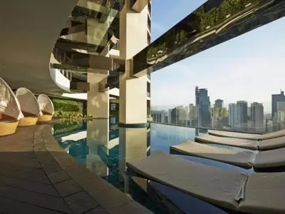 a swimming pool with a view of a city at Affordable Suite at Gramercy Makati with Balcony & Parking in Manila