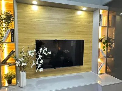 a flat screen tv in a living room at Sakura Suites At Mall of Asia Near Airport in Manila