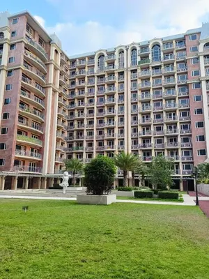 a large building with a statue in front of it at BP952 With Balcony and River View in Manila