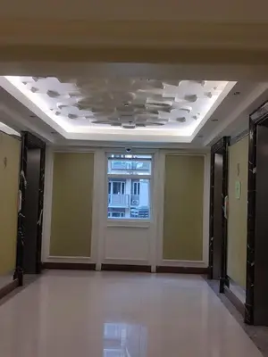 an empty room with a ceiling with a window at BP952 With Balcony and River View in Manila