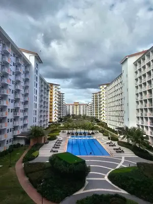 an aerial view of a resort with a swimming pool at SMDC Field REsidences condo unit in Manila