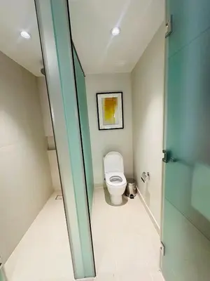 a small bathroom with a toilet in a room at Novotel Suites Residences Mandaluyong-Makati by Marj in Manila