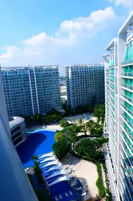 a view of a resort with a pool and buildings at Azure Staycation By Star in Manila