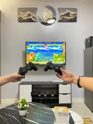 two people playing a video game with nintendo wii controllers at Dandelion Shore Residences 1BR in Manila