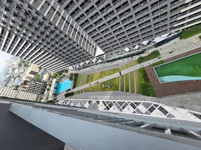 a rendering of a building with a pool in the middle at 1BR Condotel with Balcony at FAME Residences #FM10 in Manila