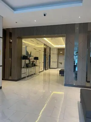 an empty lobby of a building with a glass wall at D&M cosy staycation in Manila