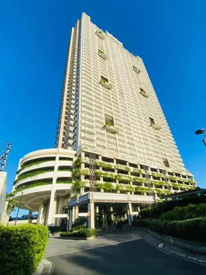 a tall white building with plants on it at Scenic place to stay in manila 3618 in Manila
