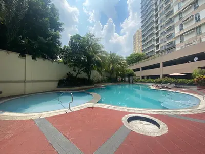 a large swimming pool in a building at 1 BR Condo in Quezon City at Avida New Manila in Manila