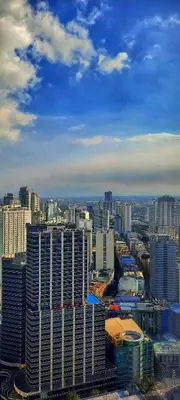a view of a large city with tall buildings at Air Residence Makati Cozy City View in Manila