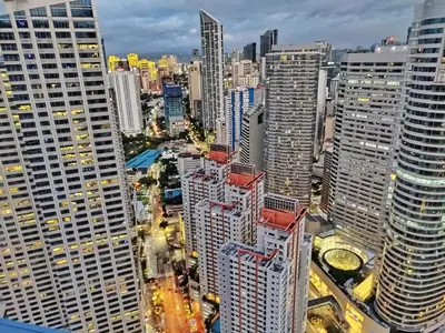an aerial view of a city with tall buildings at Air Residence Makati Cozy City View in Manila