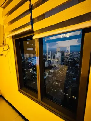 a window with a view of a city at Relaxation Getaway in Manila
