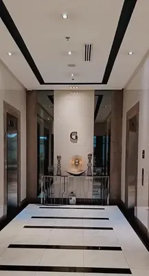 a lobby with a large room with a fountain at Budget Stay Across NAIA TERMINAL 3 C2-5J in Manila