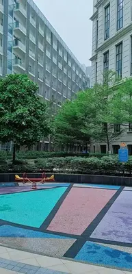 a building with a swimming pool in front of a building at Budget Stay Across NAIA TERMINAL 3 C2-5J in Manila