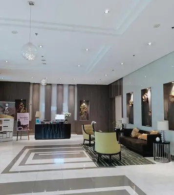 a lobby with a couch and chairs and a table at Budget Stay Across NAIA TERMINAL 3 C2-5J in Manila