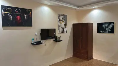 a room with a flat screen tv on a wall at Lenjawi Resort and Events Place in Bitangan