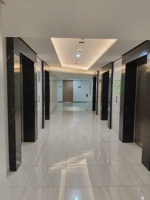 an empty hallway in a building with black and white walls at Chino Roces Makati - Free Parking - Red Residences in Manila