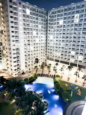 an aerial view of a large building with a large pool at Manila Daze in Manila