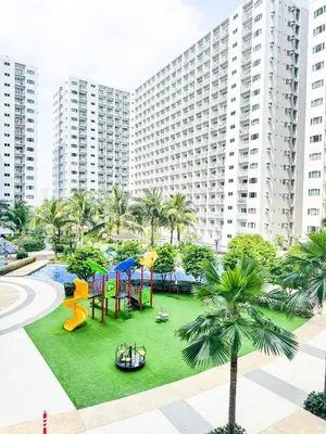 a playground in front of a large building at Manila Daze in Manila