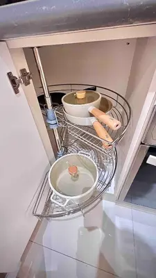 a shelf in a kitchen with plates and bowls at 3 Bedroom Beautiful and Spacious Penthouse in Makati in Manila