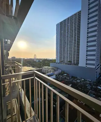 a view from the balcony of a building at 2 Br Condo Apartment near PICC, CCP, WTC & Star City at Coast Residences, Pasay City in Manila