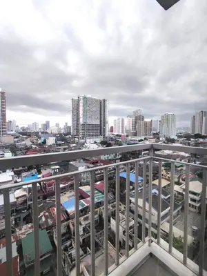 a view of a city from a balcony at 2 Br Condo Apartment near PICC, CCP, WTC & Star City at Coast Residences, Pasay City in Manila