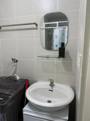 a bathroom with a sink and a mirror at Jazz mall Tower 4 Rm 323 Spacious 1 bedroom with Balcony netflix 100mbps in Manila