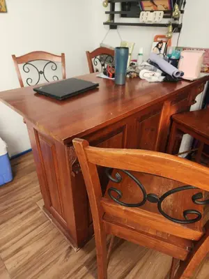 a wooden desk with a laptop on top of it at Family room with private pool in Manila