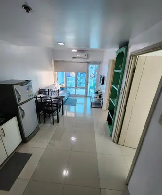 a room with a kitchen and a dining room at MNM Place - Sea Residence 0F in Manila