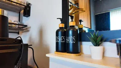 three black bottles sitting on top of a counter at Studio near SM Megamall 400MBPS Netflix Disney HBO in Manila