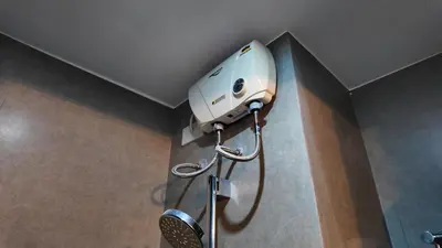 a shower head on the wall of a bathroom at Studio near SM Megamall 400MBPS Netflix Disney HBO in Manila