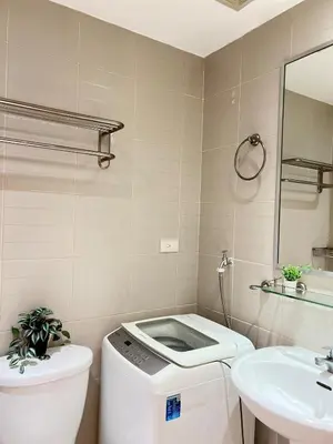 a bathroom with a toilet and a sink at Makati Room 381 1 br deluxe SMJazz T2 residence New in Manila