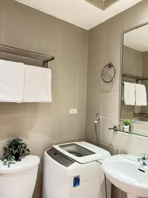 a bathroom with a toilet and a sink at Makati Room 381 1 br deluxe SMJazz T2 residence New in Manila