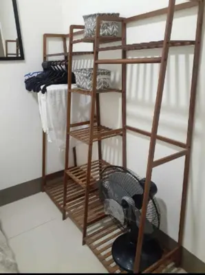 a ladder bunk bed with a fan in a room at Condo Staycation Fame Residences T2 Mandaluyong Philippines in Manila
