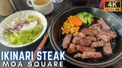a pan with meat and vegetables and a bowl of salad at The Grand Staycation at MOA - Unit 7102 Hotel-like in Manila