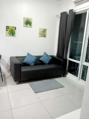 a black couch in a living room with a window at MNM Place - Sea Residence 1B in Manila