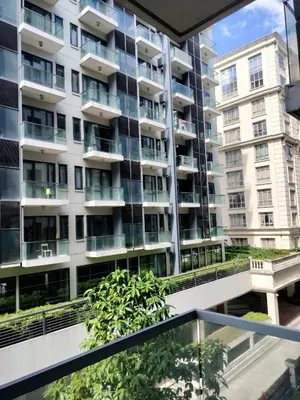 an apartment building seen from the balcony of a building at Rqui Family Room Near Airport in Manila
