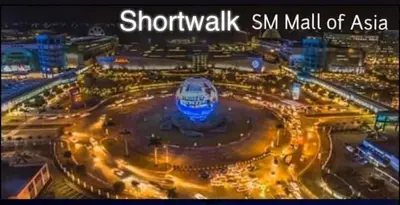 a view of a city at night with lights at Shore Residence a32 shortwalk Mall of Asia in Manila