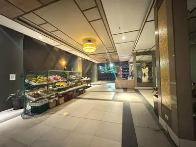 a hallway of a building with a grocery store at 2BR Resort Type condo w city view Sheridan in Manila