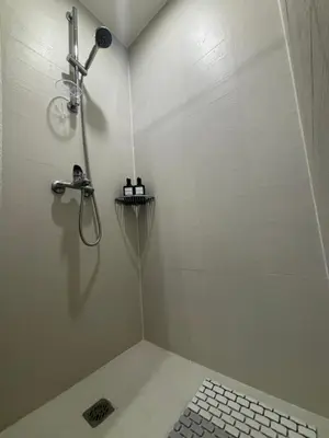 a shower in a bathroom with a shower head at The Villa at Azure South - Bahamas in Manila