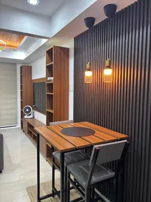 a dining room with a wooden table and chairs at The Villa at Azure South - Bahamas in Manila