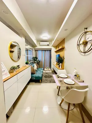 a kitchen and living room with a table and a dining room at Scandi-Style & Organic condo Shore 3 MOA in Manila