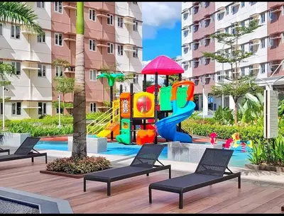 a childrens playground with a play equipment in a building at Harmony Suite Hope Trece Cavite in Trece Martires