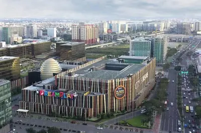 an aerial view of a large building in a city at Beach Haven Condo in MOAs Shore Resort near Okada City of Dreams Solaire in Manila
