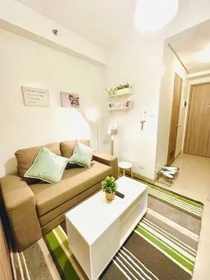 a living room with a couch and a table at CB 1162 House in Manila