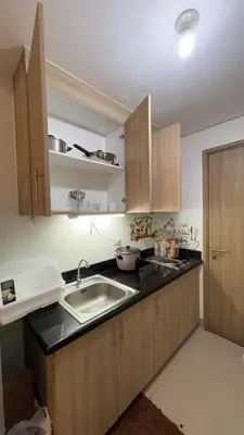 a kitchen with a sink and a counter top at Yuttari in Manila