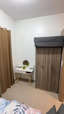 a room with a stage and a table with a mirror at Yuttari in Manila