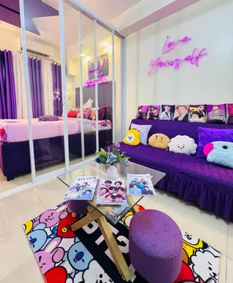 a living room with purple furniture and a purple couch at BTS CRIB at MOA PASAY CITY in Manila