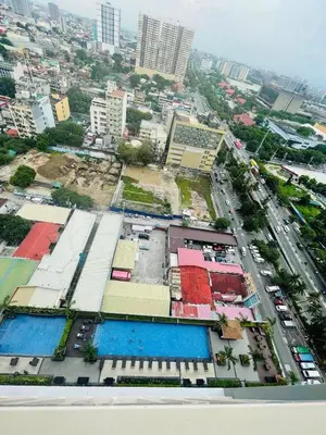 an aerial view of a city with buildings and a street at JCS Place in Manila