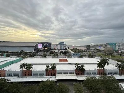 a view of a city with buildings and palm trees at Sea Residences Mall of Asia- Jerson in Manila