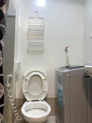 a small bathroom with a toilet and a sink at Ohana Residences by SMDC in Manila